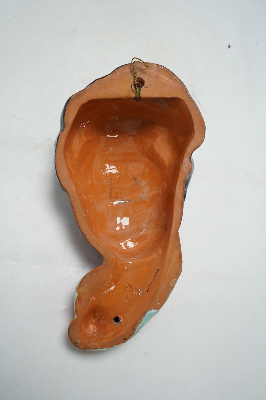 A Goldscheider terracotta wall mask, 29cm. Condition - fair to good